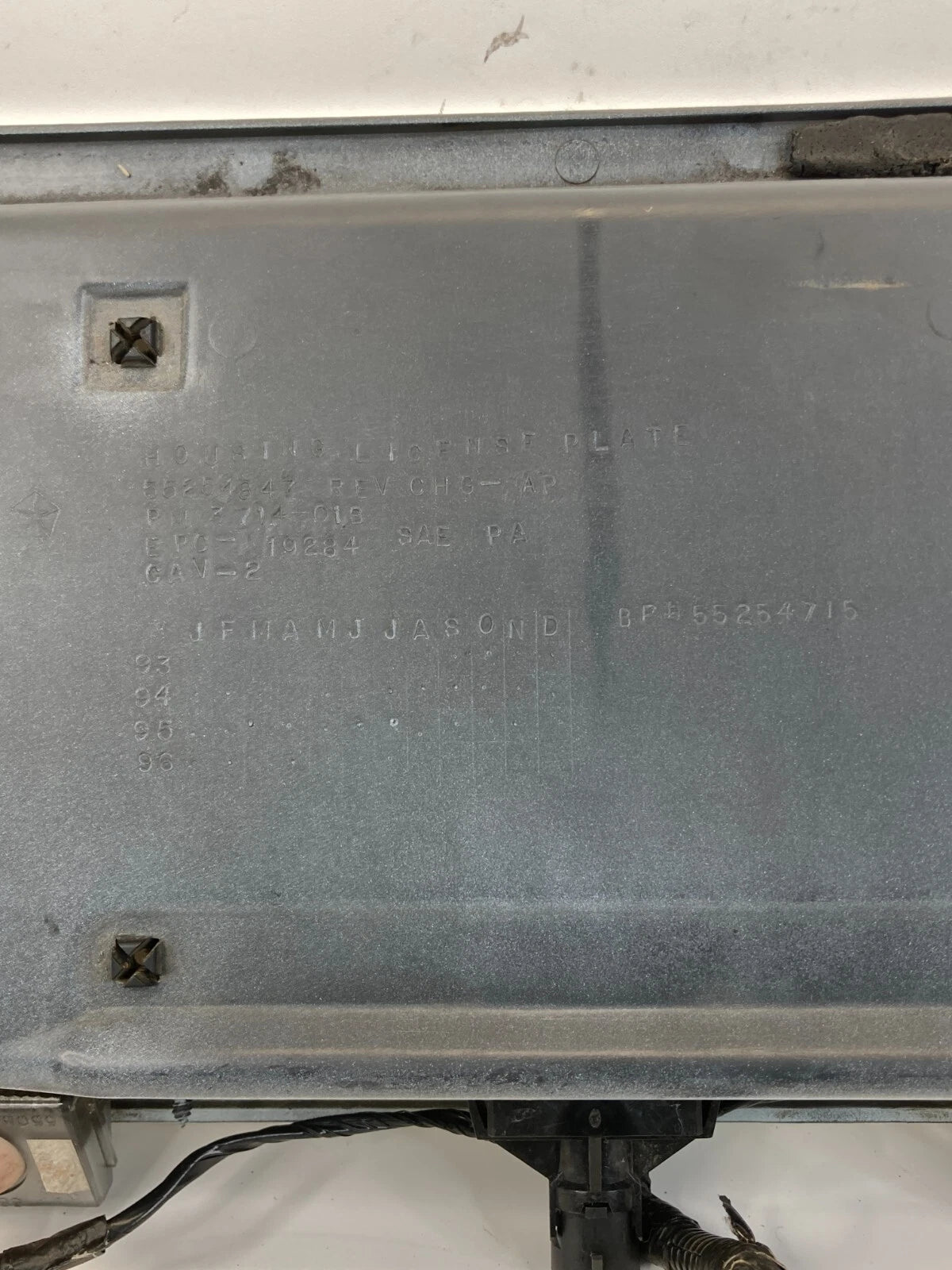 1995-1998 JEEP GRAND CHEROKE REAR TRUNK LICENSE PLATE HOLDER GARNISH MOLDING OEM