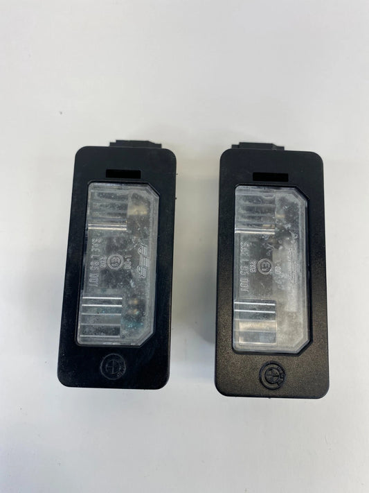 2006 BMW 330XI SEDAN REAR TRUNK LID LICENSE PLATE LIGHT LAMP SET PAIR OEM