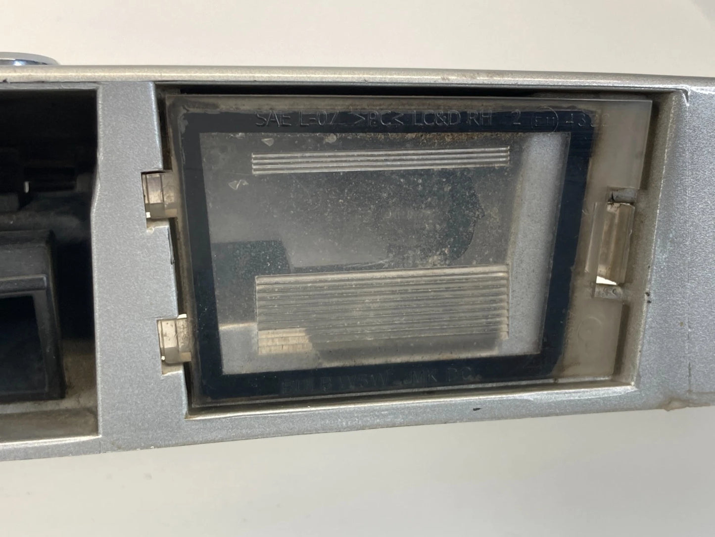 2009-2017 JEEP PATRIOT COMPASS TRUNK TAIL LIFT GATE LID LICENSE PLATE BEZEL OEM