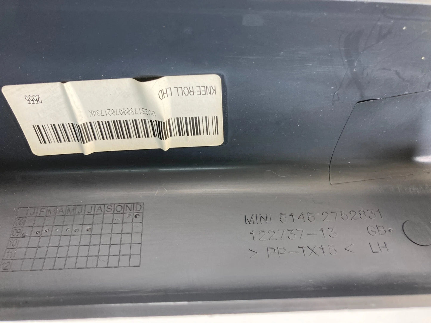 2007-2012 MINI COOPER FRONT RIGHT KNEE GUARD GLOVE BOX OPENER 51452752831 OEM