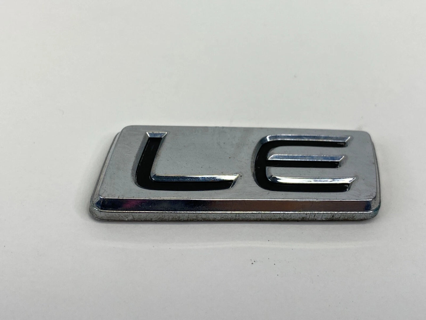 2009-2013 TOYOTA COROLLA LE REAR EMBLEM TRUNK LOGO BADGE NAMEPLATE LUGGAGE OEM
