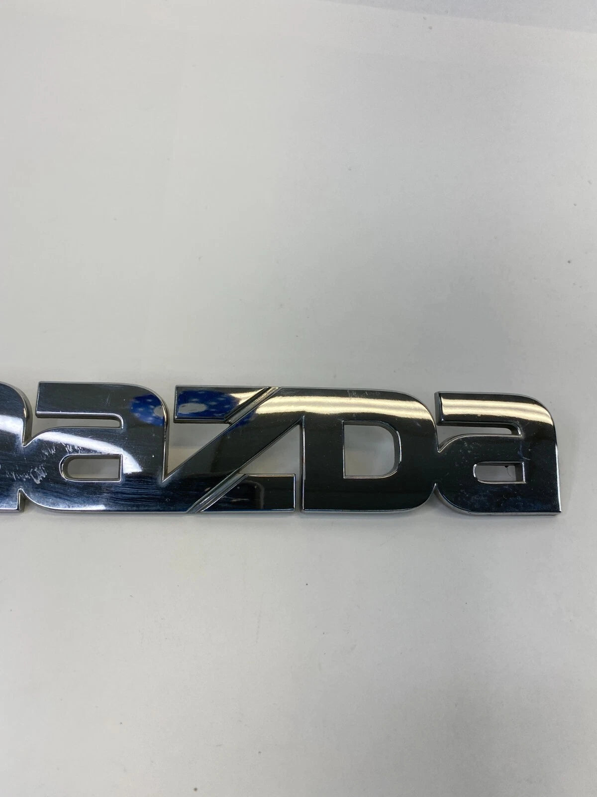 2000-2006 MAZDA MPV REAR TRUNK DECK LID NAME NAMEPLATE BADGE LOGO LC62-51710 OEM