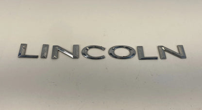 2003-2006 LINCOLN NAVIGATOR REAR TRUNK LID NAMEPLATE LINCOLN EMBLEM LOGO BADGE
