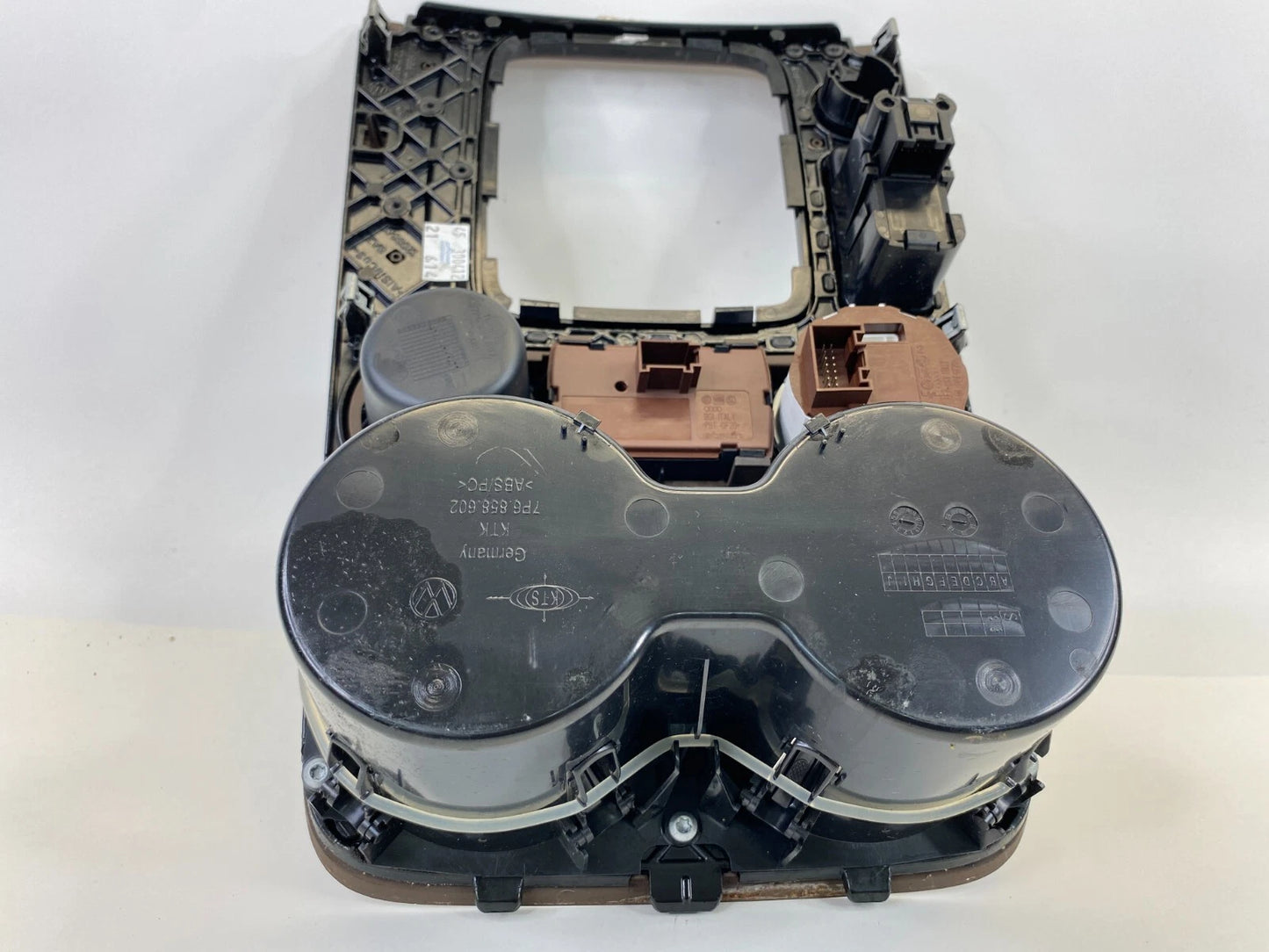 11-14 VW TOUAREG CENTER CONSOLE SHIFT PLATE TRIM W/ TRACTION SWITCH & CUP HOLDER
