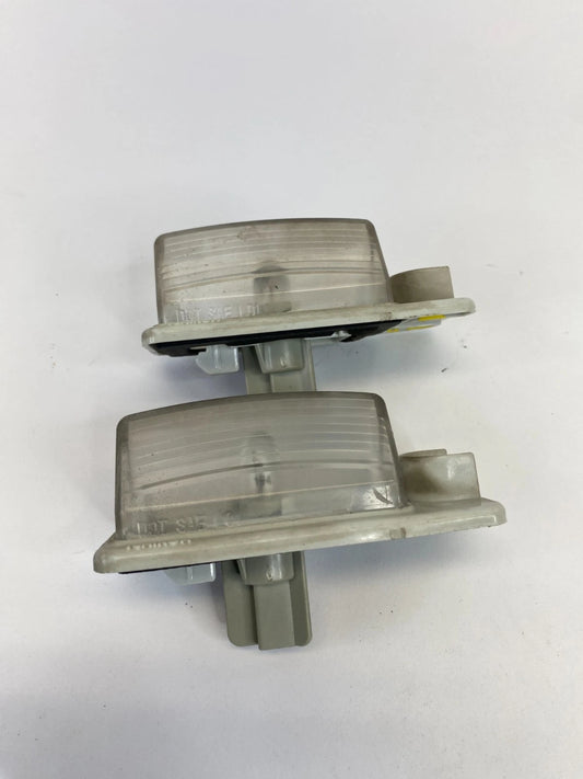 2007-2012 NISSAN ALTIMA LICENSE PLATE LIGHT LAMP TAG HOUSING LENS PAIR OEM