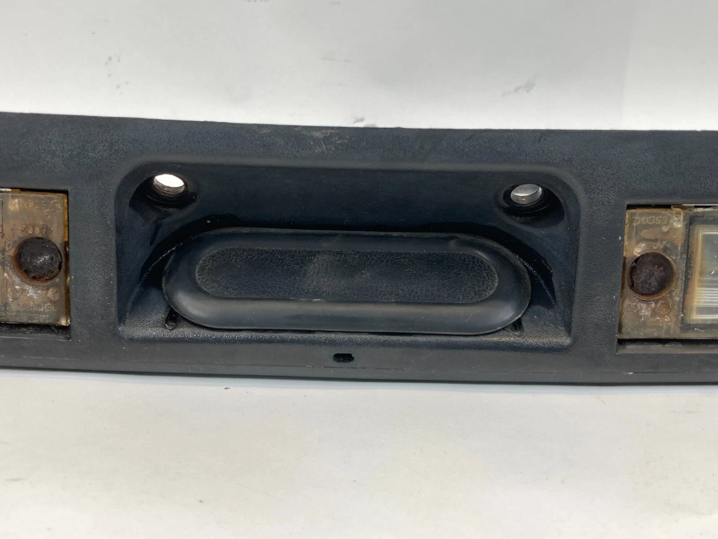 01-05 DODGE CARAVAN REAR TRUNK LIFT GATE LICENSE PLATE HANDLE PANEL 04857231AE