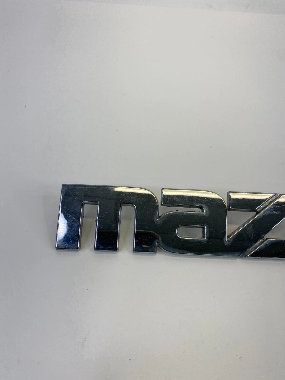2000-2006 MAZDA MPV REAR TRUNK LID SYMBOL NAMEPLATE BADGE LOGO LC62-51710 OEM