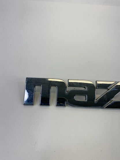 2000-2006 MAZDA MPV REAR TRUNK LID SYMBOL NAMEPLATE BADGE LOGO LC62-51710 OEM