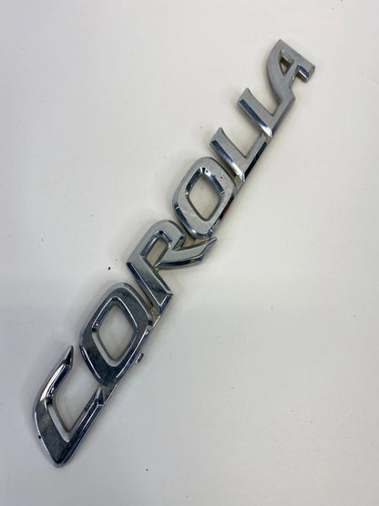 2003-2008 TOYOTA COROLLA REAR TRUNK LID NAMEPLATE EMBLEM BADGE OEM
