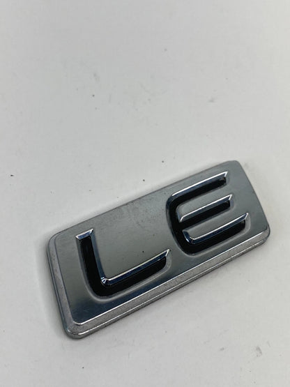 2009-2013 TOYOTA COROLLA LE REAR EMBLEM TRUNK LOGO BADGE NAMEPLATE LUGGAGE OEM