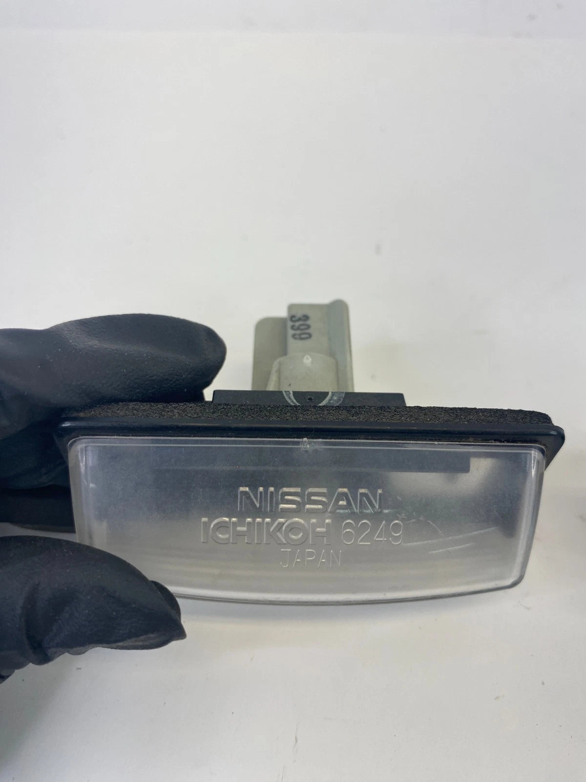 08-13 2008-2013 Nissan Rogue Rear Trunk License Plate Light Lamp Assembly OEM