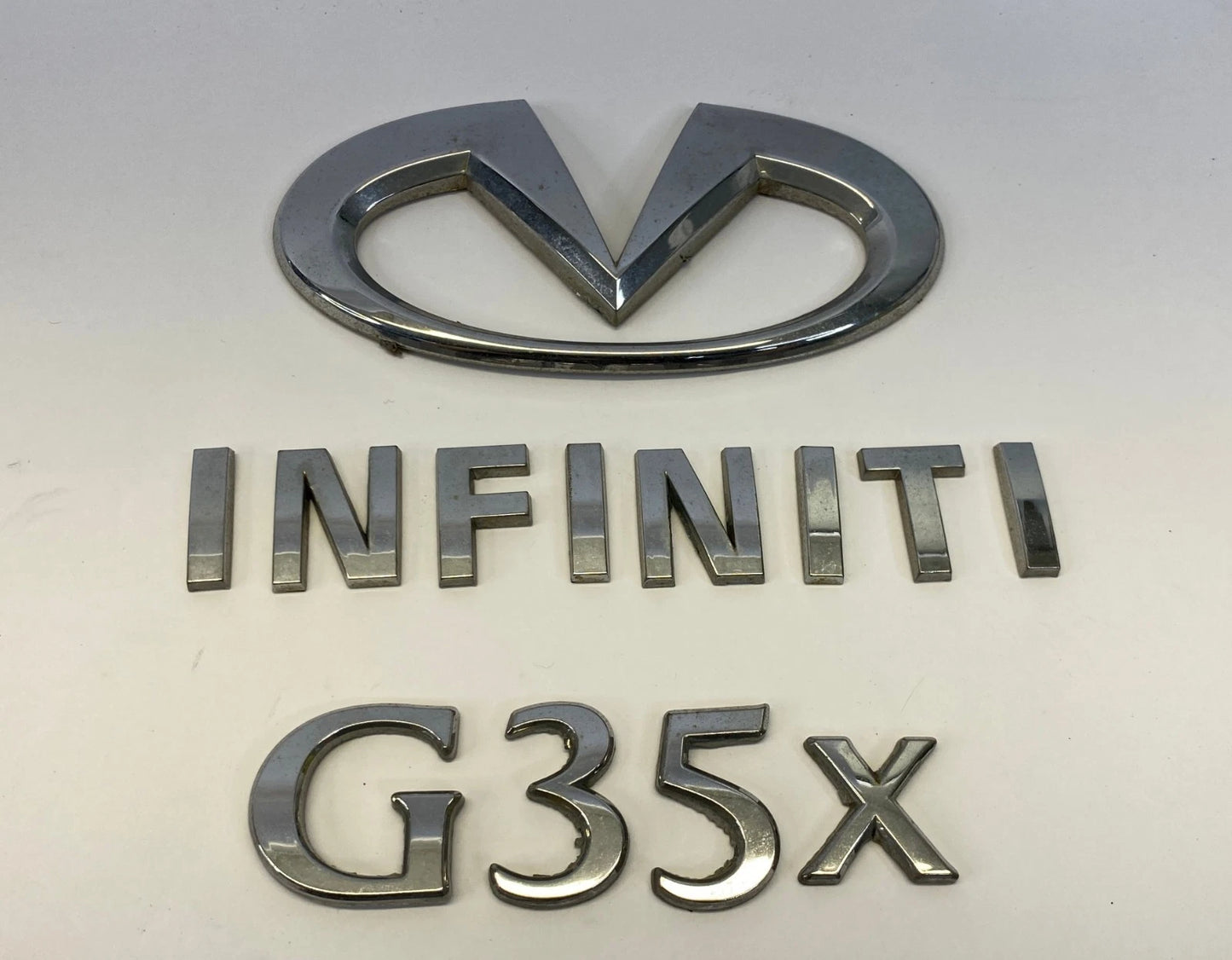 2007 2008 INFINITI G35 REAR TRUNK LID LOGO LETTERS EMBLEM SET OEM 84890JK60