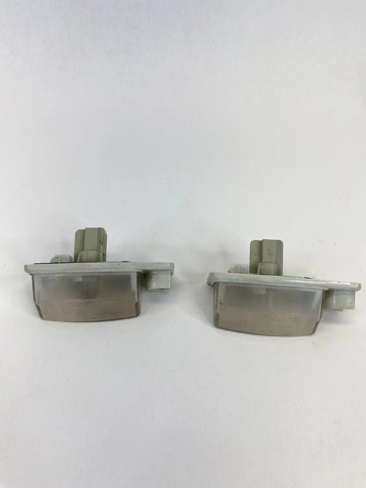 2007-2012 NISSAN ALTIMA LICENSE PLATE LIGHT LAMP TAG HOUSING LENS PAIR OEM
