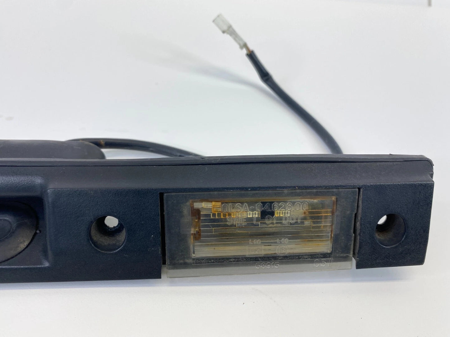 2003-2012 LAND ROVER RANGE ROVER REAR LICENSE PLATE LIGHT MOLDING ASSEMBLY OEM