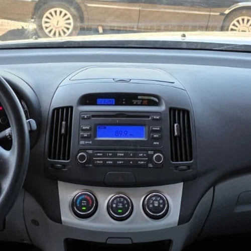 07-10 HYUNDAI ELANTRA DASH RADIO BEZEL AC AIR VENT TRIM W/ DIGITAL CLOCK OEM