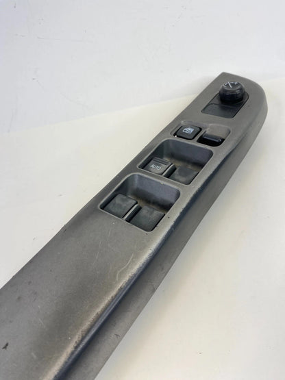 2000-2004 NISSAN XTERRA FRONT LEFT MASTER WINDOW CONTROL SWITCH W/ BEZEL OEM