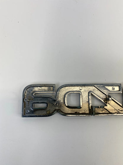 2000-2006 MAZDA MPV REAR TRUNK LID SYMBOL NAMEPLATE BADGE LOGO LC62-51710 OEM