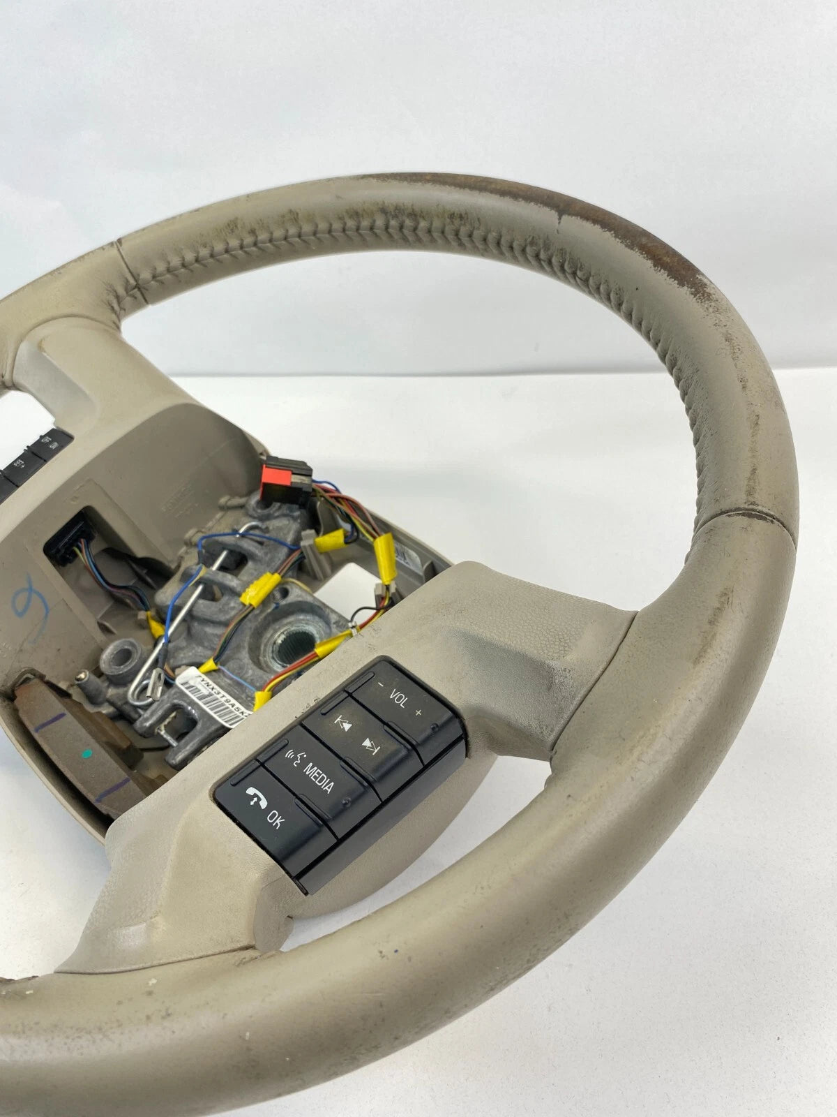 2009 2010 2011 MERCURY MARINER STEERING WHEEL W/ CONTROL SWITCHES TAN LEATHER