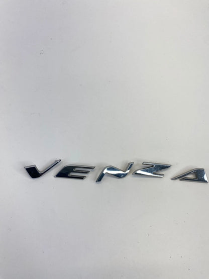 2009-2015 TOYOTA VENZA REAR LIFTGATE HATCH EMBLEM CENTER NAMEPLATE OEM FACTORY