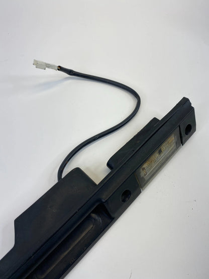 2003-2012 LAND ROVER RANGE ROVER REAR LICENSE PLATE LIGHT MOLDING ASSEMBLY OEM