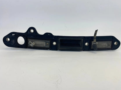 2005-2010 VOLKSWAGEN JETTA REAR LICENSE PLATE LIGHT LAMP OPENER HANDLE COVER OEM