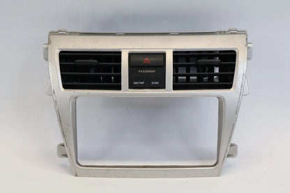 2007-2012 TOYOTA YARIS CENTER DASH RADIO BEZEL W/ AIR VENTS & HAZARD SWITCH OEM