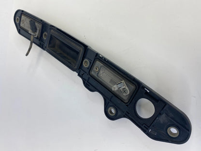 2005-2010 VOLKSWAGEN JETTA REAR LICENSE PLATE LIGHT LAMP OPENER HANDLE COVER OEM