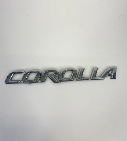 2003-2008 TOYOTA COROLLA REAR TRUNK LID NAMEPLATE EMBLEM BADGE OEM