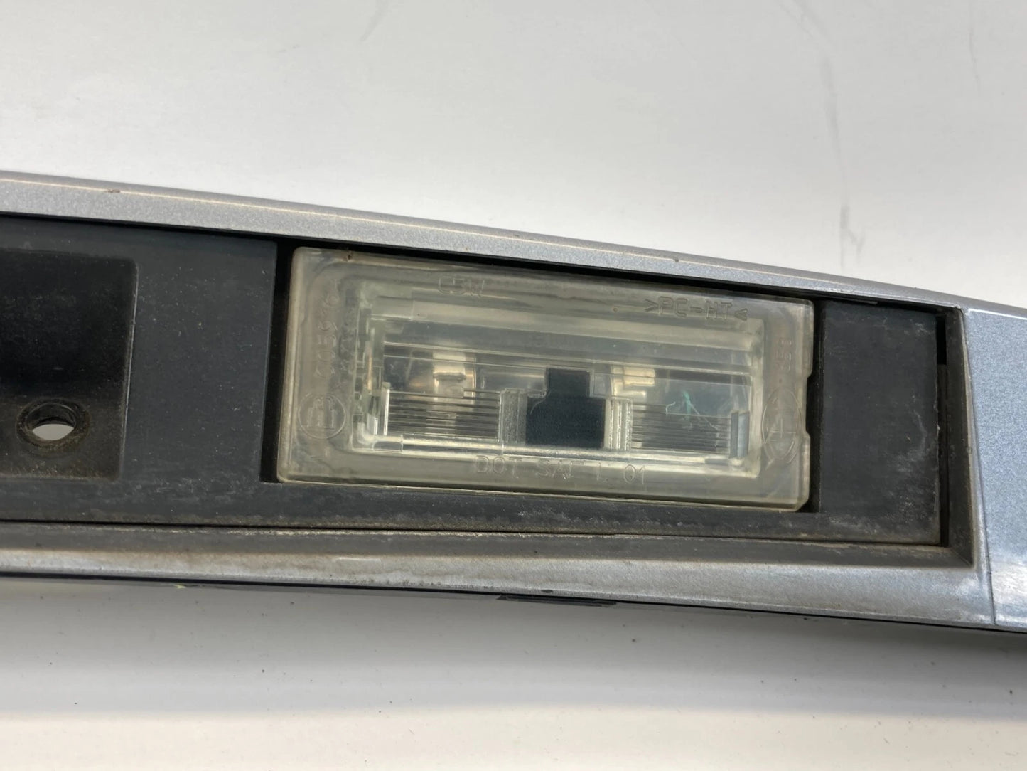 2004-2010 BMW X3 REAR TRUNK GARNISH STRIP LICENSE PLATE MOLDING TRIM 51137052452