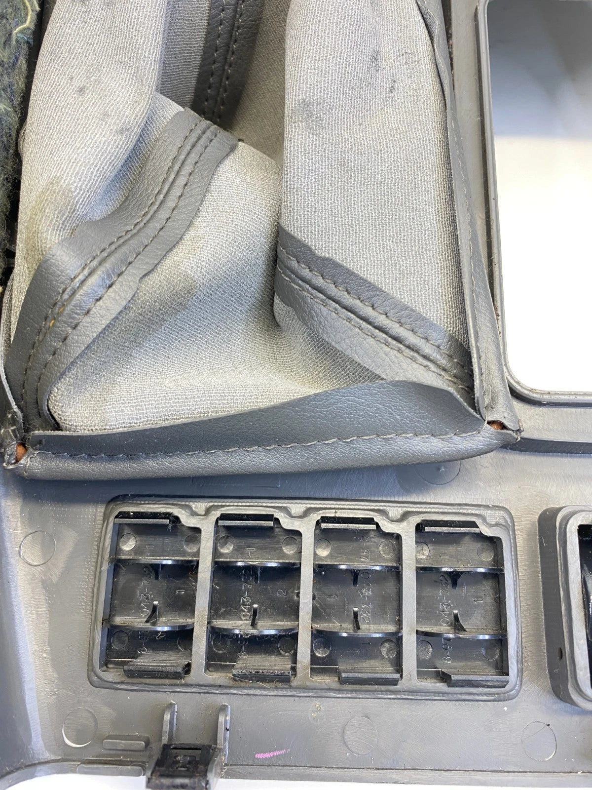 19-02 ISUZU TROOPER CENTER CONSOLE SHIFTER TRIM BEZEL W/ WINTER POWER SWITCH OEM
