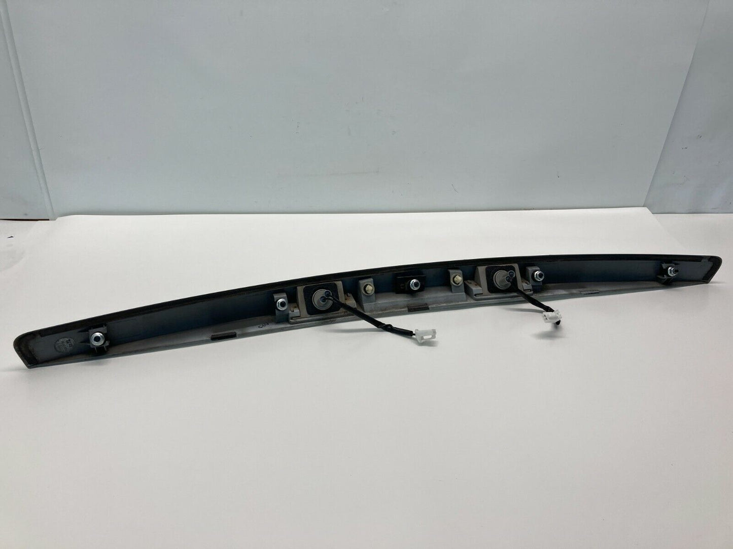 2007 Kia Spectra Rear Trunk License Plate Bezel Trim Finish Panel 925011L0 OEM