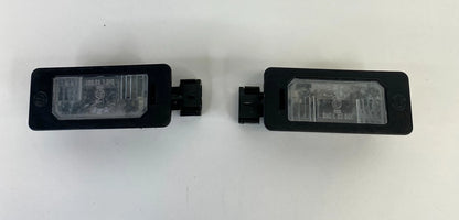 2006 BMW 330XI SEDAN REAR TRUNK LID LICENSE PLATE LIGHT LAMP SET PAIR OEM