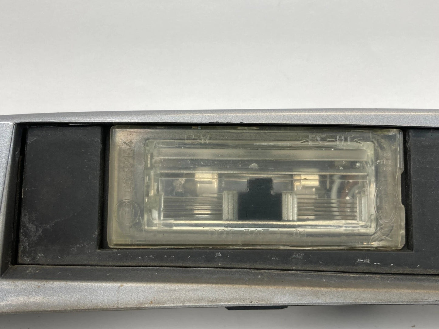 2004-2010 BMW X3 REAR TRUNK GARNISH STRIP LICENSE PLATE MOLDING TRIM 51137052452