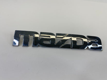 2000-2006 Mazda MPV Rear Trunk Lid Symbol Nameplate Badge Logo LC62-51710 OEM