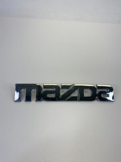 2000-2006 Mazda MPV Rear Trunk Lid Symbol Nameplate Badge Logo LC62-51710 OEM