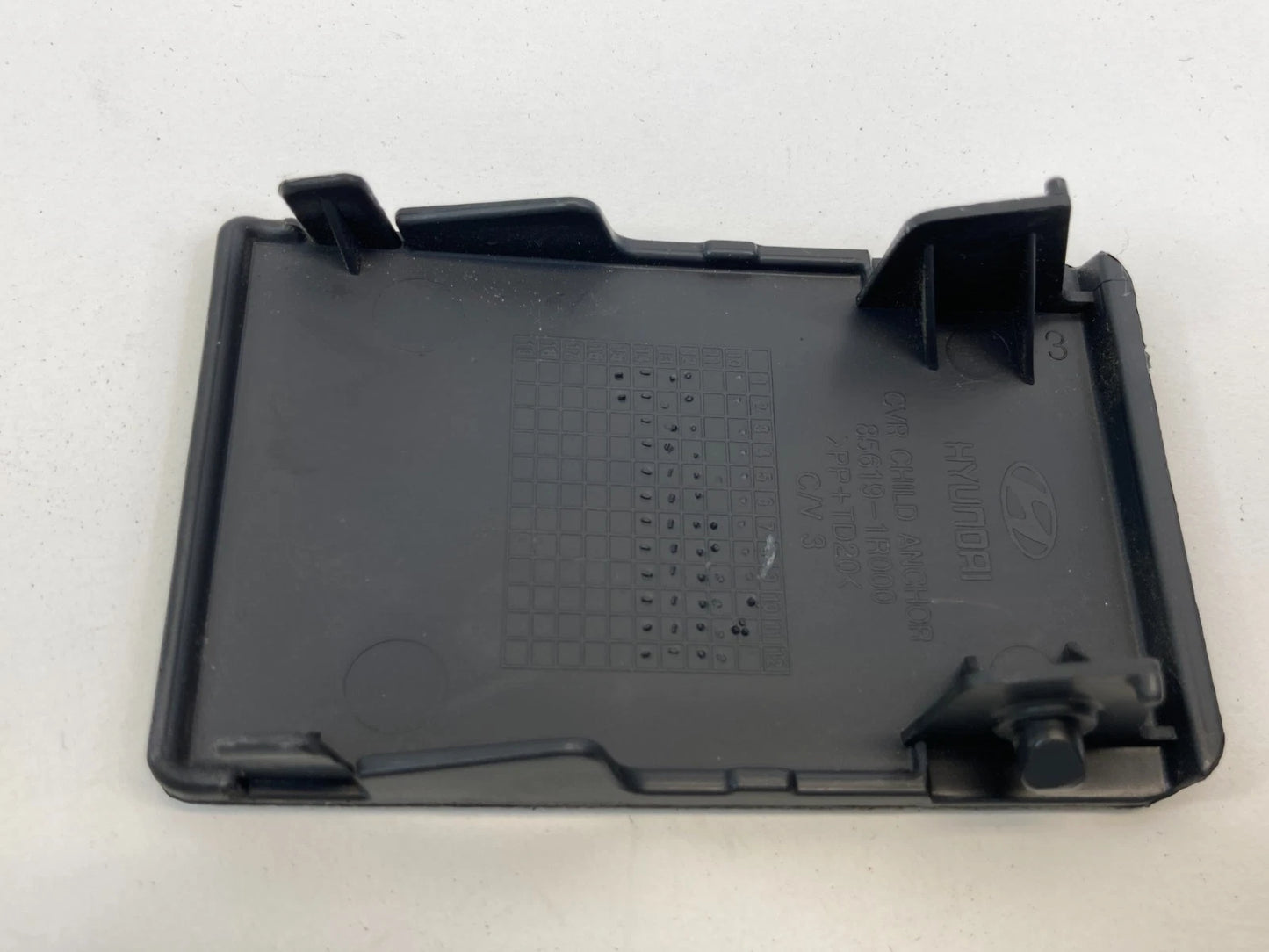 2012-2017 HYUNDAI ACCENT REAR SEAT CHILD RESTRAINT ANCHOR COVER TRIM 85619-1R000