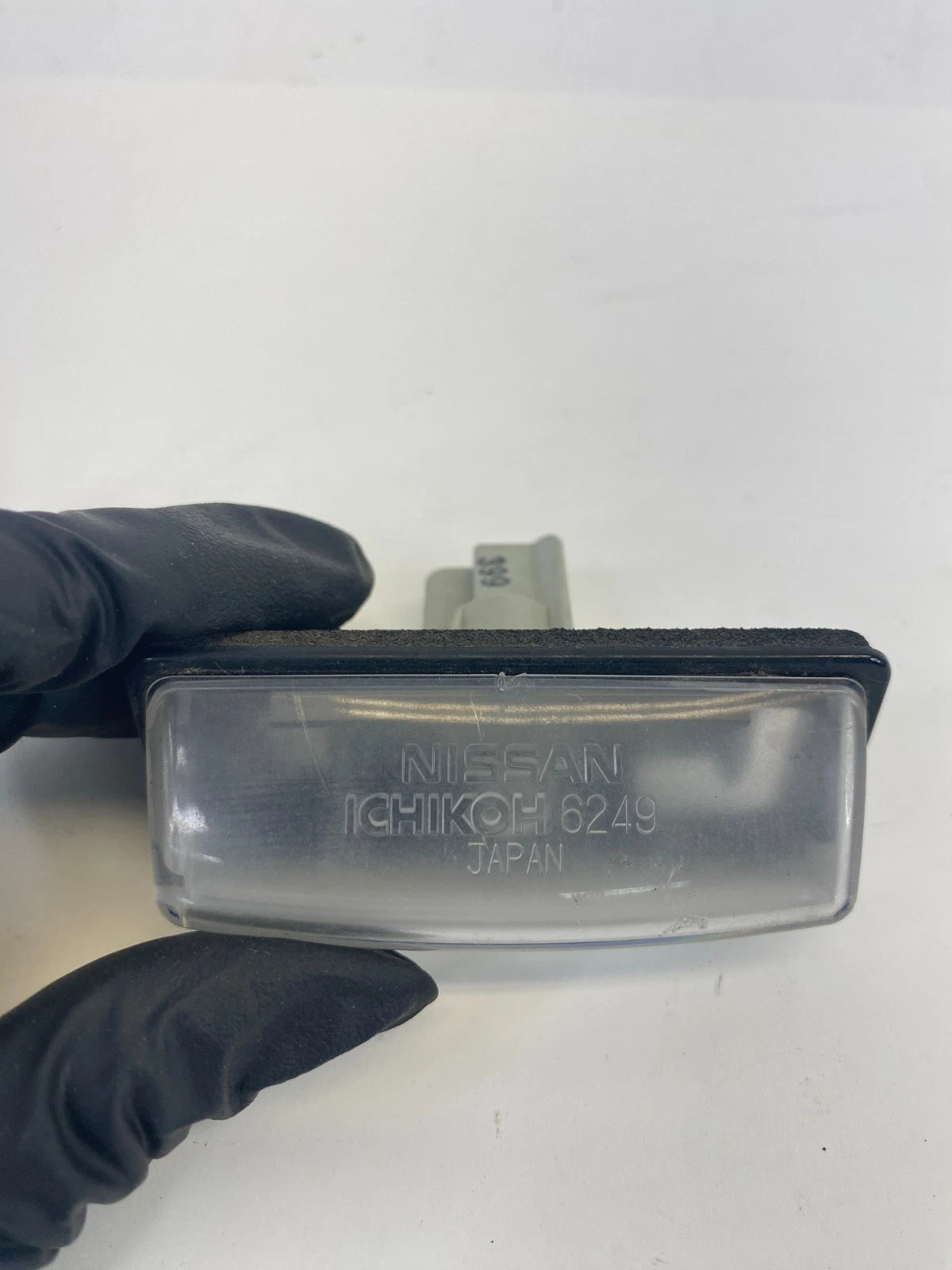 08-13 2008-2013 Nissan Rogue Rear Trunk License Plate Light Lamp Assembly OEM