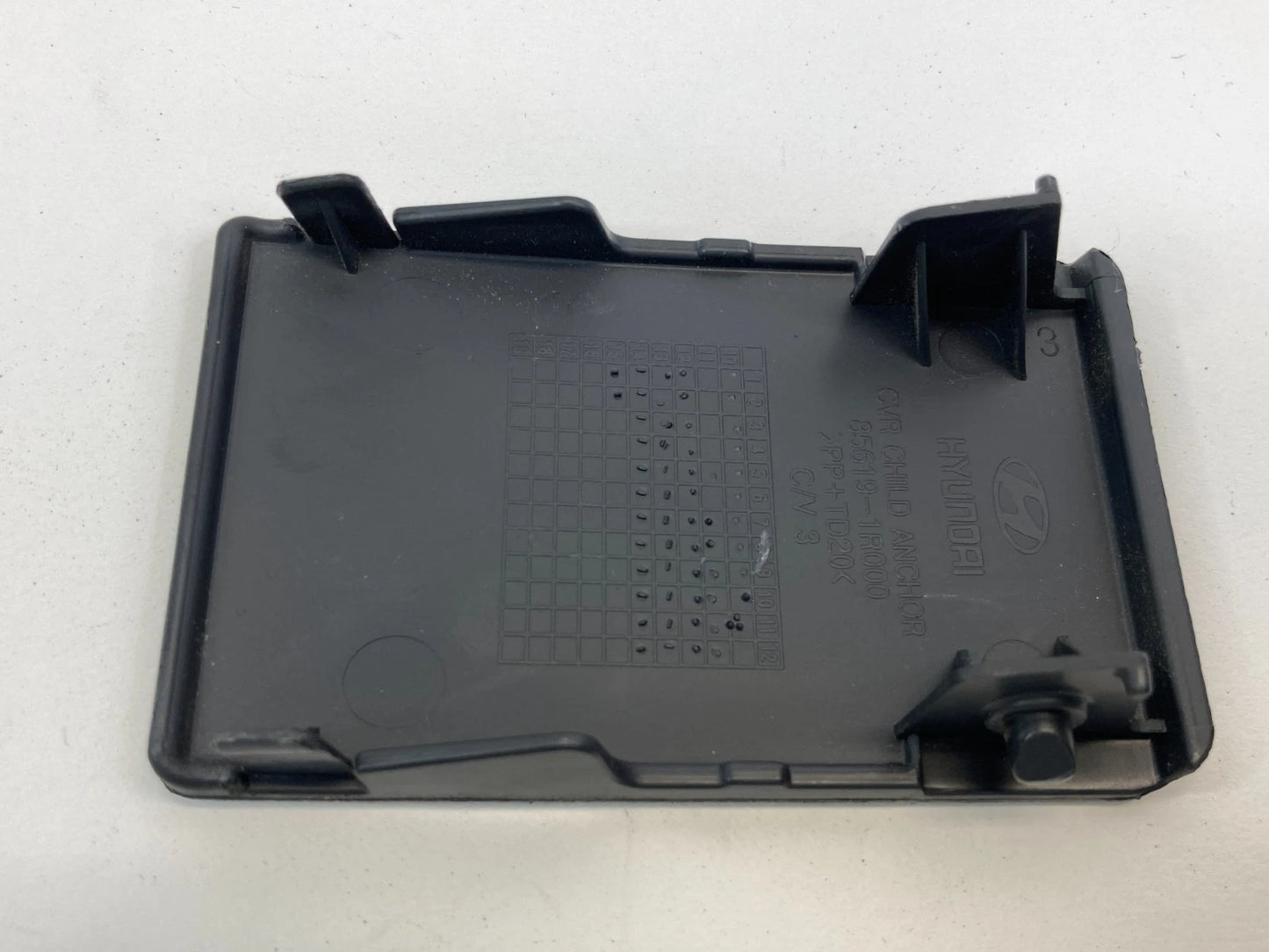 2012-2017 HYUNDAI ACCENT REAR SEAT CHILD RESTRAINT ANCHOR COVER TRIM 85619-1R000