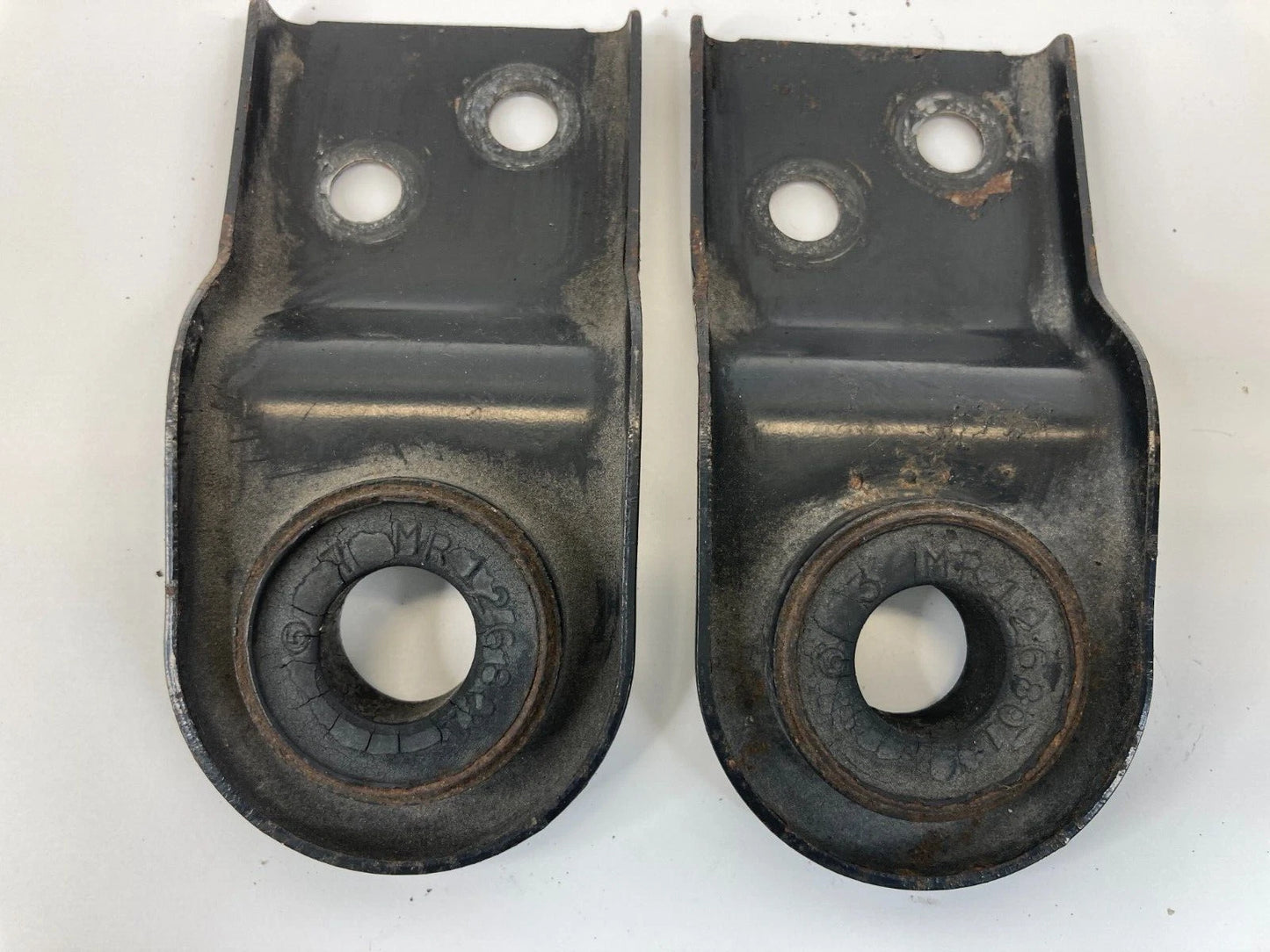1997-2003 MITSUBISHI MONTERO SPORT RADIATOR BRACKET SUPPORT PAIR SET OEM