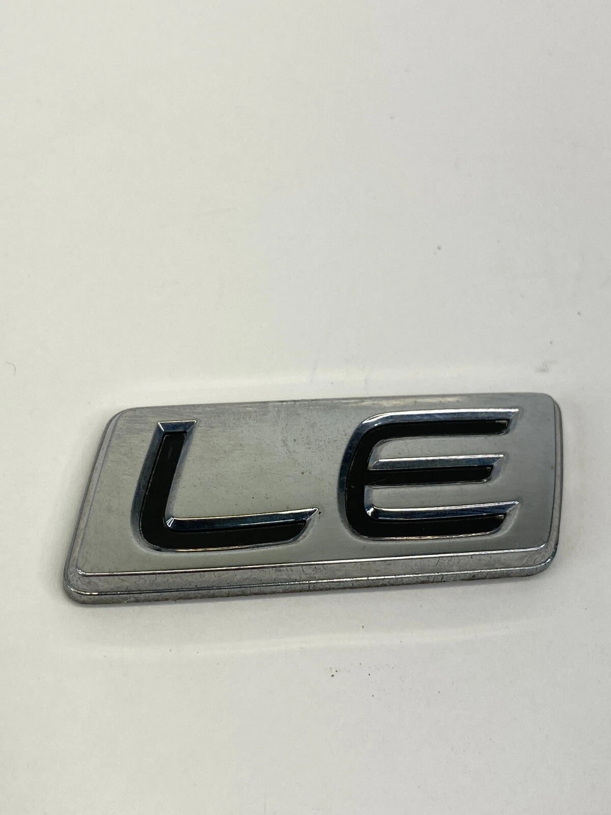 2009-2013 TOYOTA COROLLA LE REAR EMBLEM TRUNK LOGO BADGE NAMEPLATE LUGGAGE OEM