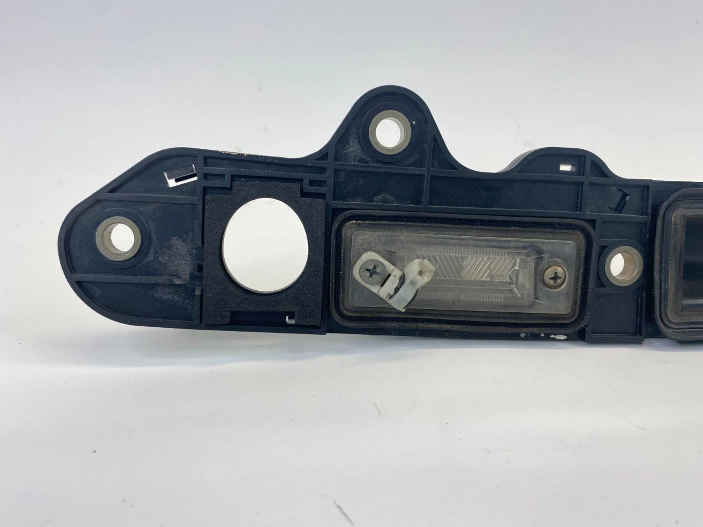 2005-2010 VOLKSWAGEN JETTA REAR LICENSE PLATE LIGHT LAMP OPENER HANDLE COVER OEM