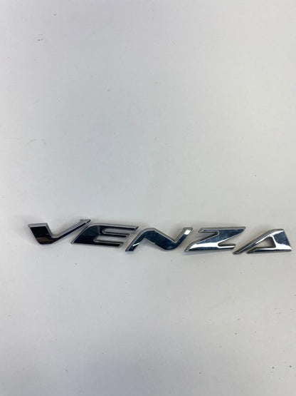 2009-2015 TOYOTA VENZA REAR LIFTGATE HATCH EMBLEM CENTER NAMEPLATE OEM FACTORY